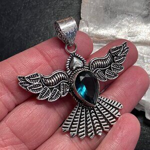 Faceted Blue Gem Set in an Open Winged Bird Pendant (56)
